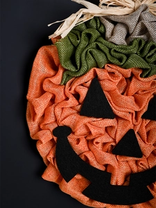 Detailed texture of burlap pumpkin wreath for Halloween party hanging decoration