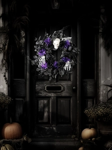 Macro detail of Halloween wreath featuring black roses, purple sequins and skulls