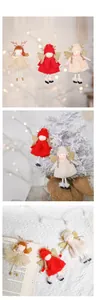 Dettagli di bambole angelo in peluche con ali di paillettes per decorazioni di alberi di Natale