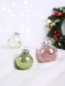 Close-up of PET Christmas balls with green glitter and beads on a snowy background