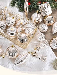 Detailed Christmas ornament set featuring champagne gold and white glitter hanging balls