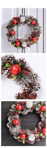 Macro view of Christmas wreath featuring natural pinecones, red balls and snowy pine needles