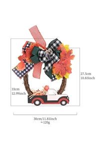 Detail of fall harvest wreath with maple leaves, pumpkin truck and size specifications