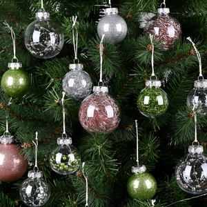 Assorted PET Christmas tree ornaments with glitter and tinsel inside on green branches
