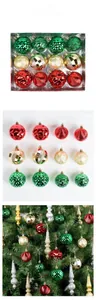 Detailed view of red gold and green textured Christmas baubles on a holiday tree