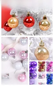 Detail of assorted Christmas tree ornaments with glossy and glittery finishes in a gift set