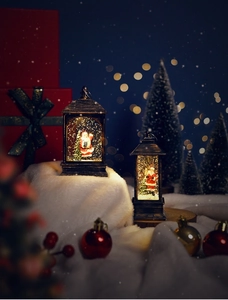 Macro detail of retro bronze Christmas lanterns with Santa scenes and glowing LED lights