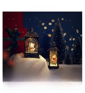 Detail view of retro Christmas snow globe lanterns with Santa Claus and festive interior