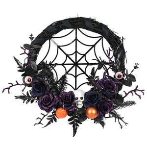 Macro view of Halloween wreath with black roses, skull, and eyeballs on a spider web base