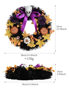 Halloween wreath detail with skull, purple roses, and pumpkin ornaments on a black base