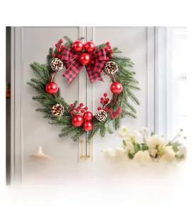 Detail of 45cm Christmas wreath with red berries, pine cones and tartan bow