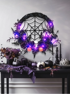Detail of Halloween wreath with purple roses, skulls, eyeballs and purple LED lights