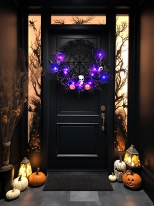 Close-up of Halloween wreath with purple roses, skulls, and glowing LED lights on a black door