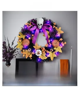 Close-up of Halloween wreath with purple LED lights, skull, pumpkin and sequins