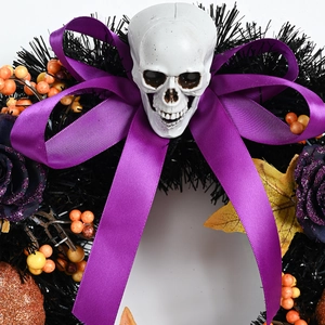 Halloween wreath with white skull, purple bow and roses, orange berries on black base