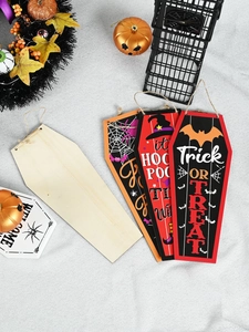 Detailed view of four coffin-shaped Halloween wooden ornaments with festive patterns and jute rope