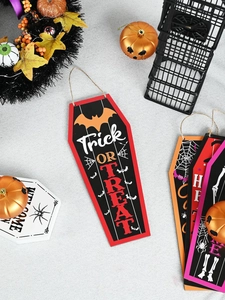 Close-up of coffin-shaped Halloween wood sign with Trick or Treat text and bat details