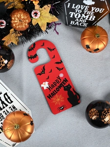 Detail of red Happy Halloween door hanger with ghosts, bats and classic spooky elements