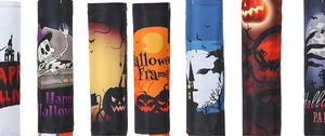 Detail of Halloween windsock flags featuring ghosts and pumpkins on dark fabric