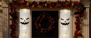 Close-up of lighted Halloween ghost windsock with LED lights on a porch