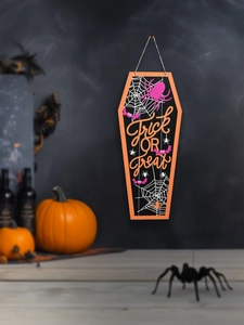 Detailed view of coffin-shaped wooden Halloween Trick or Treat door sign decoration
