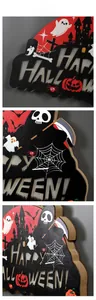 Macro detail of wooden Happy Halloween door sign with spooky castle and ghost cutouts