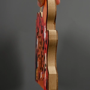 Detail of Trick or Treat Halloween wooden sign showing thick board texture and cut edges