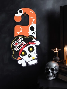 Close-up of Halloween door hanger with skull pirate design and festive spooky decorations