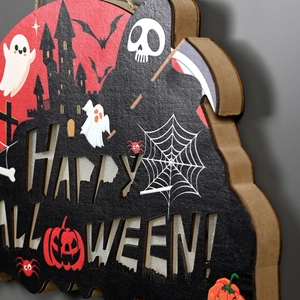 Halloween wooden door sign featuring Happy Halloween cutout with pumpkins and bats
