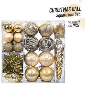 Detailed 44-piece Christmas tree ornament set in gold and silver within a clear display box