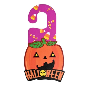 Halloween pumpkin door hanger with candy corn design and bold Halloween lettering