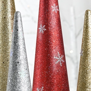 Set of glittery Christmas cone trees with white snowflake patterns in red gold and silver
