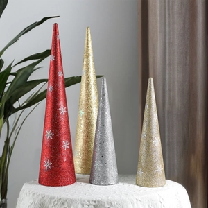 Glittery cone Christmas tree ornaments with white snowflake patterns in red gold and silver