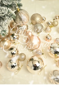 Macro shot of assorted rose gold Christmas ball ornaments with glitter and matte finishes