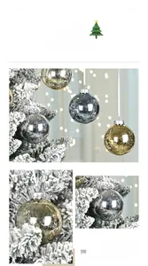 Close-up of gold and silver mirror finish Christmas ornaments on a snowy tree