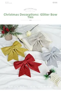 Close-up of glittery Christmas bows in red, gold, and silver on an elegant white fabric