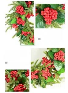 Macro detail of artificial red berry vine with green leaves for Christmas home decoration