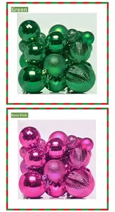Detail of green and rose red Christmas balls with glitter and matte textures in a box
