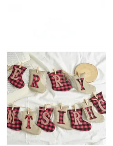 Detail of burlap Christmas stockings banner with Merry Christmas letters on twine