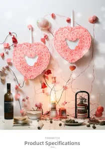 Close-up of pink rose heart wreaths on wall with romantic candles and decor