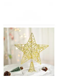 Close-up of golden iron Christmas tree topper star with woven wire detail and spring base