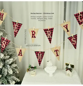 Detail of burlap Merry Christmas banner with red plaid accents and wooden clips