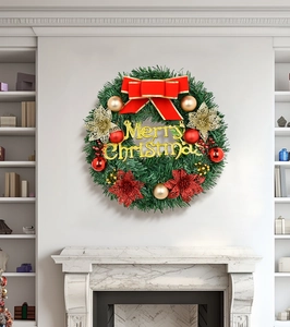 Detail of 30cm Christmas wreath with Merry Christmas sign and red gold bows on a white wall