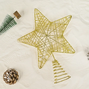 Glittery gold wire Christmas tree topper star with spiral base on snowy background
