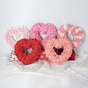 Red and pink heart-shaped artificial rose wreaths for Valentine's Day and wedding decor