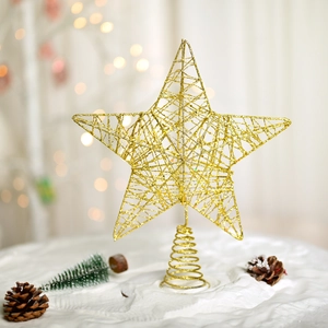 Golden glitter star tree topper with a spiral iron base over festive bokeh lights