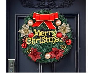 Detail of 30cm Christmas wreath with red bow, golden Merry Christmas sign and red berries