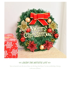 Detail of 30cm green Christmas wreath with red bow and Merry Christmas gold lettering