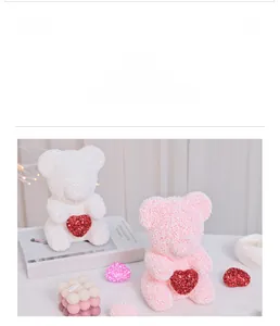 Detail of pink and white foam rose bears with red sequin hearts and bubble candles