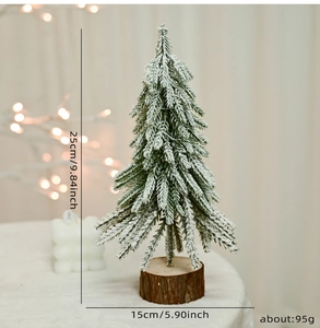Miniature snow-covered pine tree with wooden base and dimensions of 25cm in height